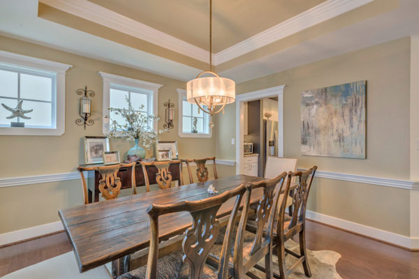 Dining room in The Villager Courtyard by Craig Builders.
